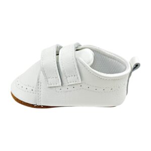 Zapatos bebé primeros pasos de cuero blanco con doble velcro, vista frontal sobre fondo neutro