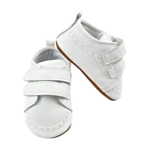 Zapatos bebé primeros pasos de cuero blanco con doble velcro, vista lateral sobre fondo neutro