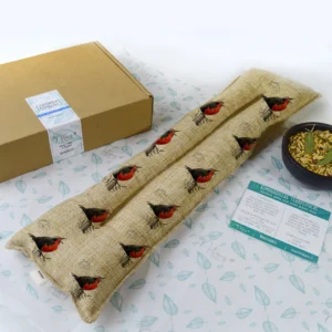 Guatero lumbar 40x20 relleno de semillas y hierbas naturales para aliviar dolor de espalda baja y zona lumbar con uso caliente o frío.