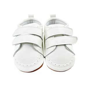 Zapatos bebé primeros pasos de cuero blanco con doble velcro, vista frontal sobre fondo neutro